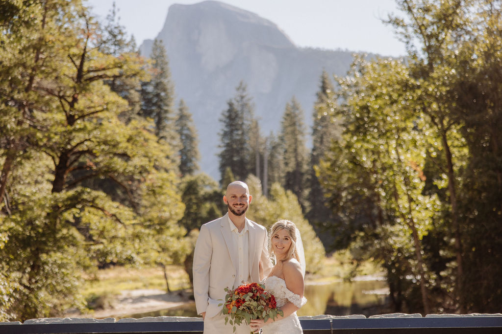 bride and groom take wedding portraits at Yosemite valley for their yosemite wedding