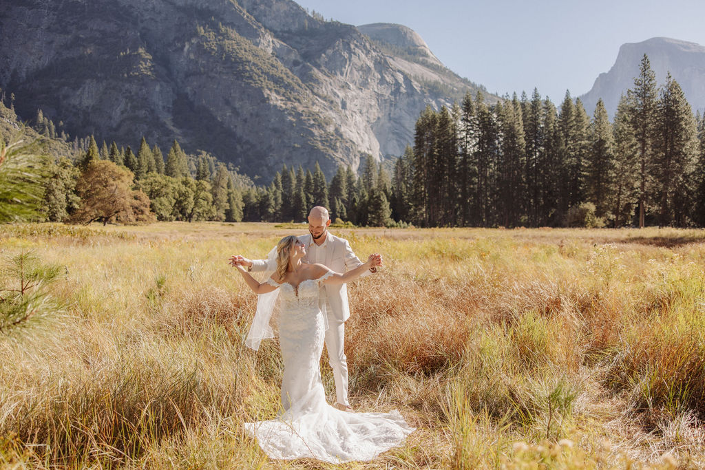 bride and groom take wedding portraits at Yosemite valley for their yosemite wedding