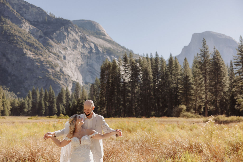 bride and groom take wedding portraits at Yosemite valley for their yosemite wedding