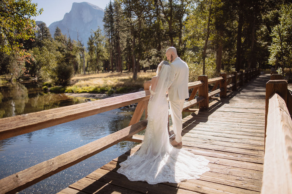  bride and groom take wedding portraits at Yosemite valley for their yosemite wedding