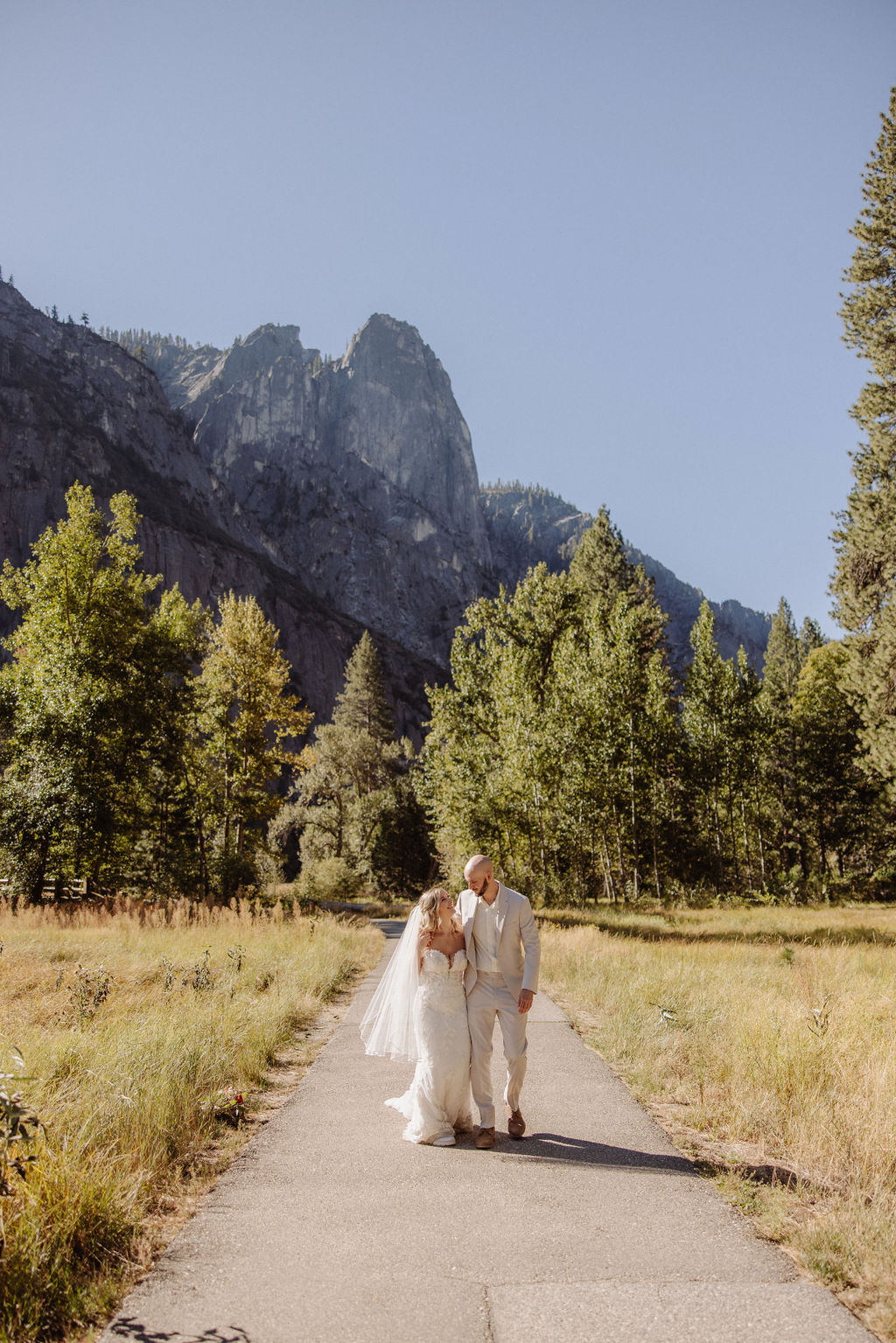 bride and groom take wedding portraits at Yosemite valley for their yosemite wedding