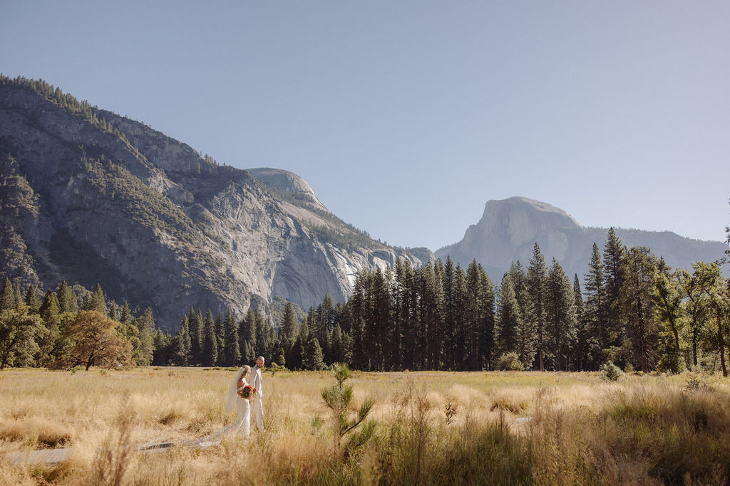 bride and groom take wedding portraits at Yosemite valley for their yosemite wedding