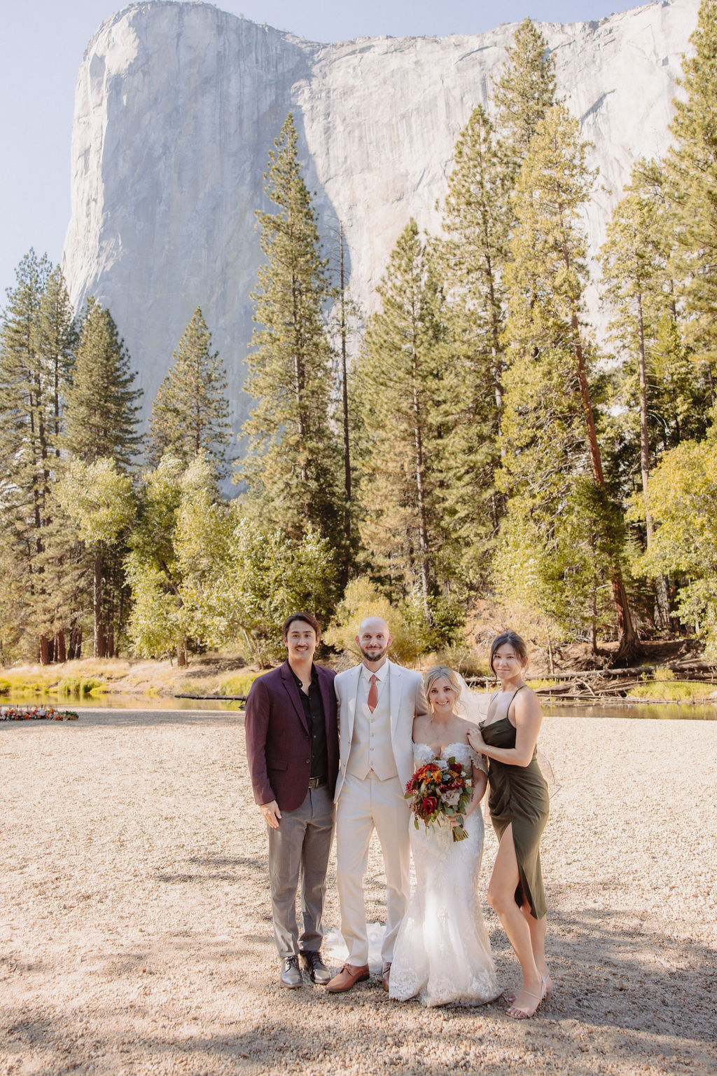 bride and groom take family portraits with family at a yosemite wedding