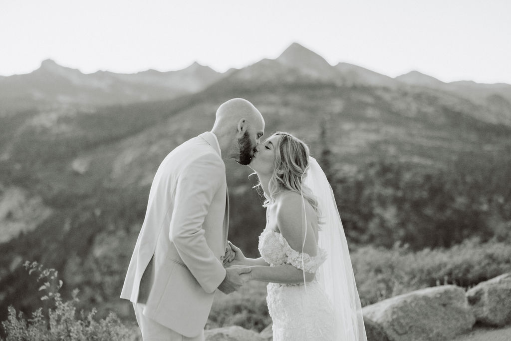 bride and groom take wedding portraits at glacier point for their yosemite wedding