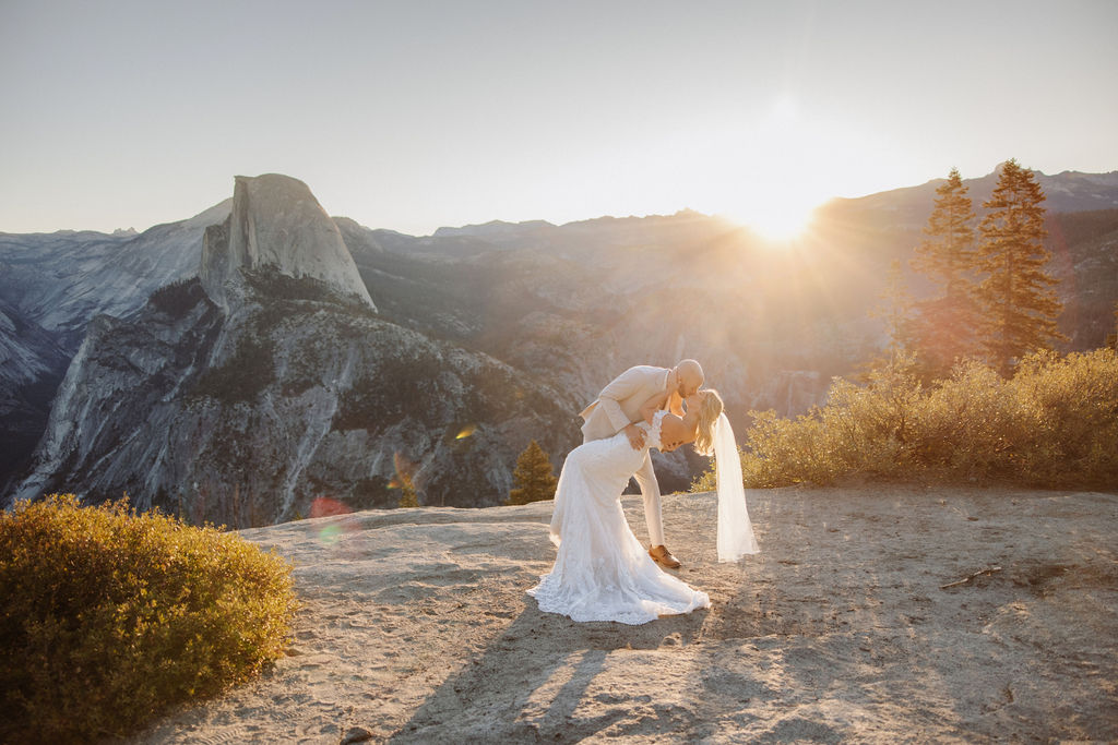 bride and groom take wedding portraits at glacier point for their yosemite wedding 