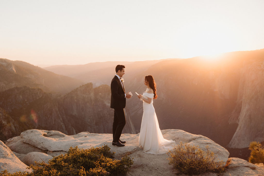 couple exchanging vows during their yosemite elopement ceremony | How to Elope in Yosemite National Park while Making it feel the most “You”