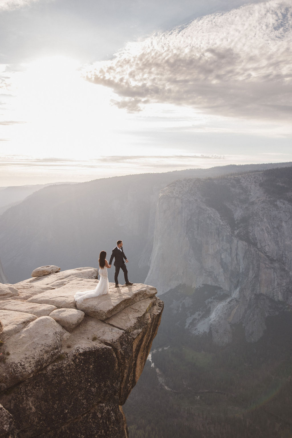 couple taking wedding portraits for their yosemite elopement | How to Elope in Yosemite National Park while Making it feel the most “You”