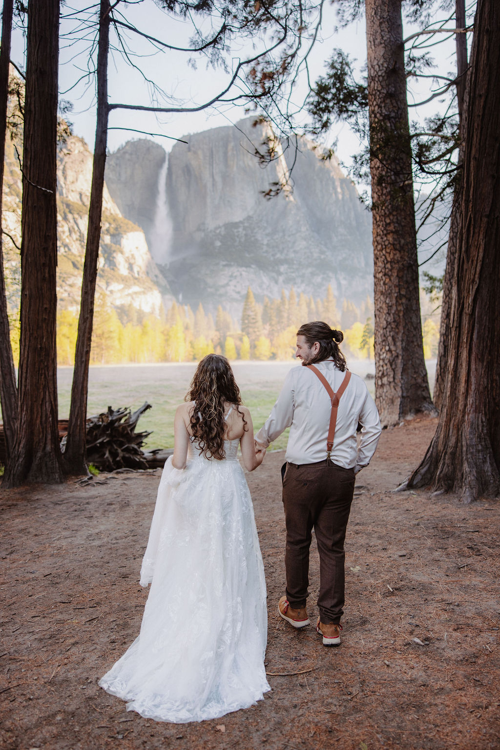bride and groom take wedding portraits in yosemite national park