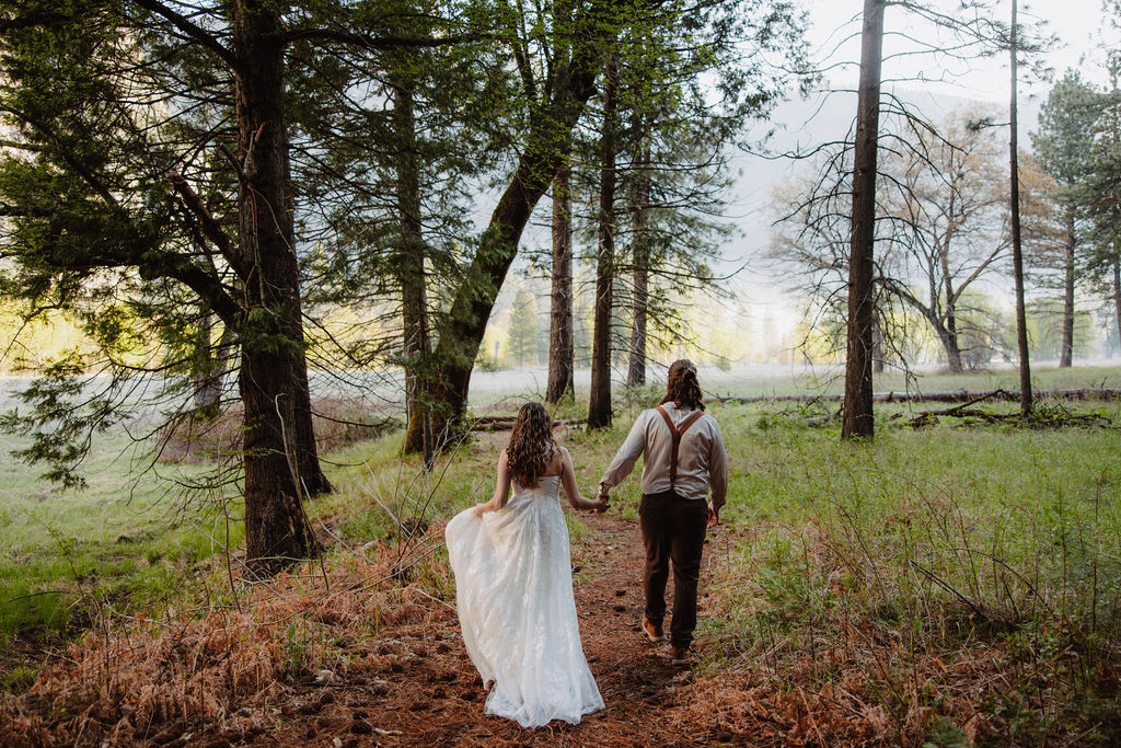 bride and groom take wedding portraits in yosemite national park