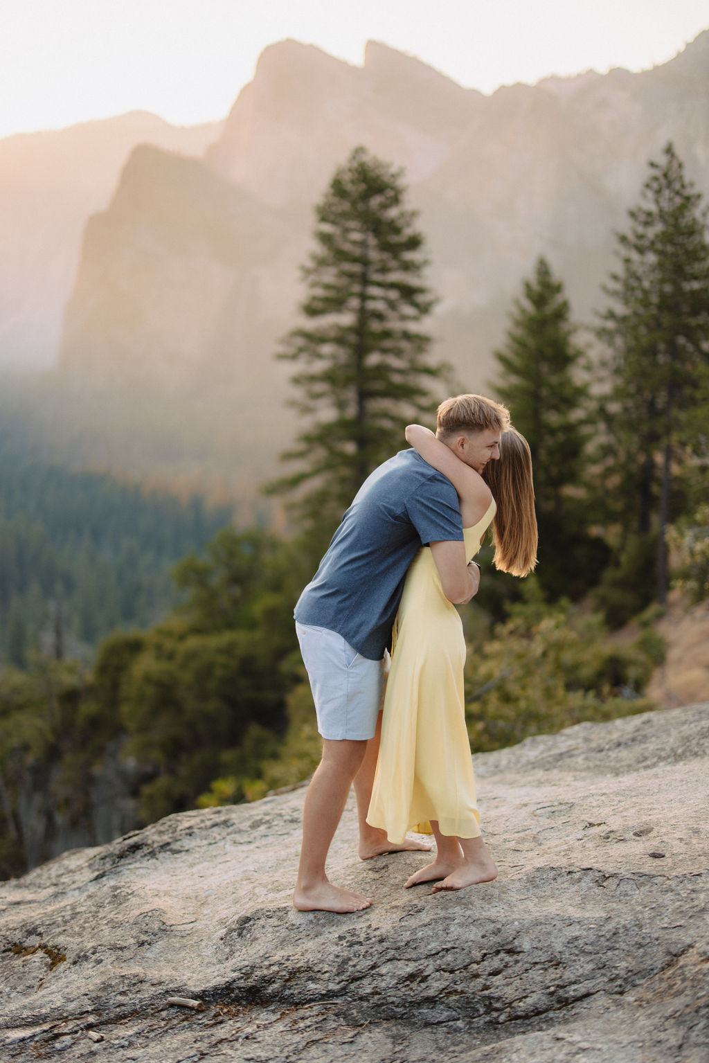couple takes engagement photos at Tunnel View in Yosemite National Park