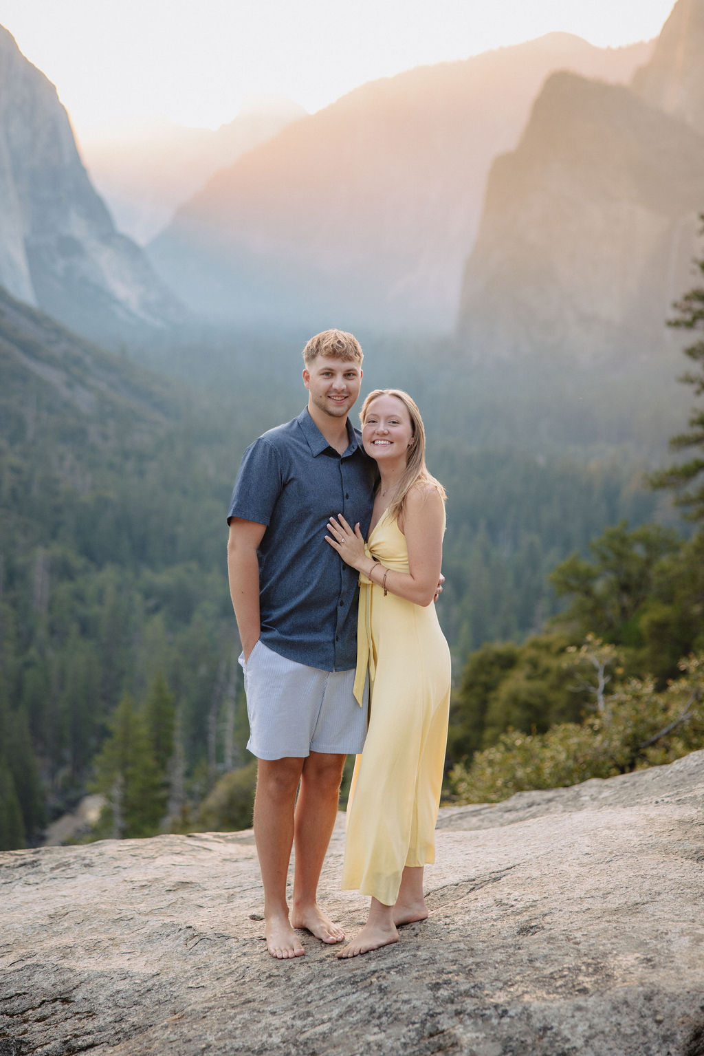 couple takes engagement photos at Tunnel View in Yosemite National Park