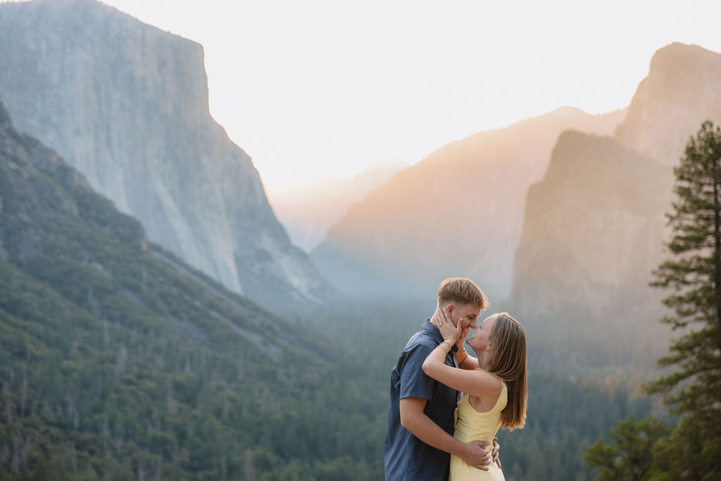 couple takes engagement photos at Tunnel View in Yosemite National Park