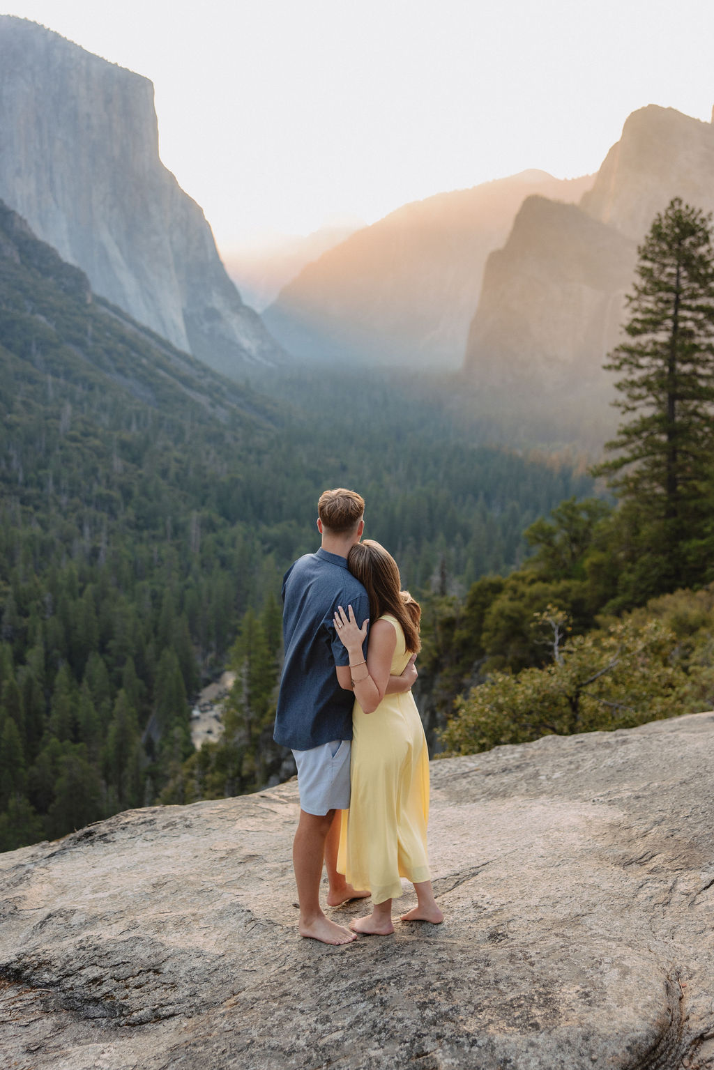couple takes engagement photos at Tunnel View in Yosemite National Park