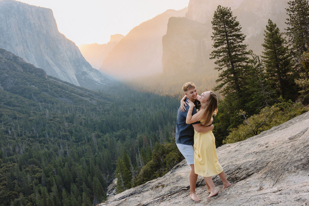 couple takes engagement photos at Tunnel View in Yosemite National Park