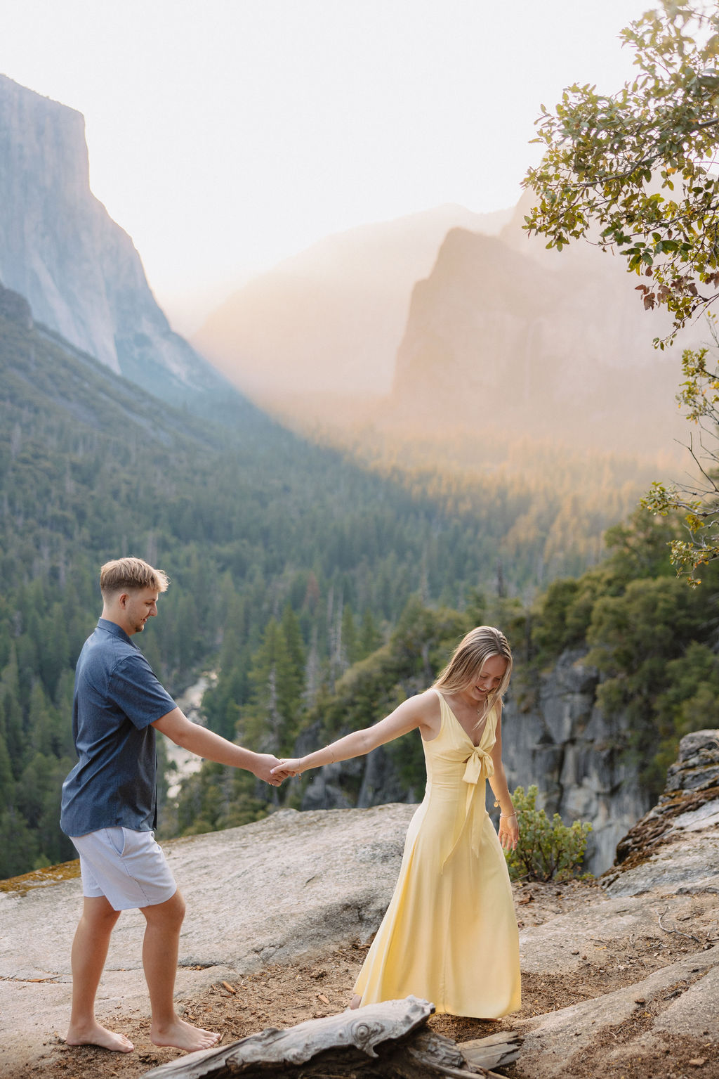 couple takes engagement photos at Tunnel View in Yosemite National Park
