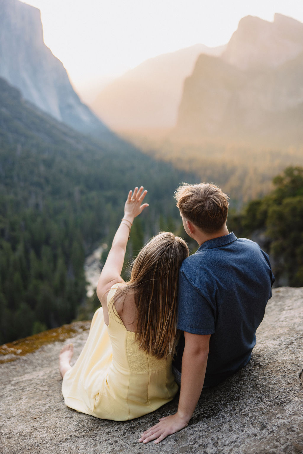couple takes engagement photos at Tunnel View in Yosemite National Park