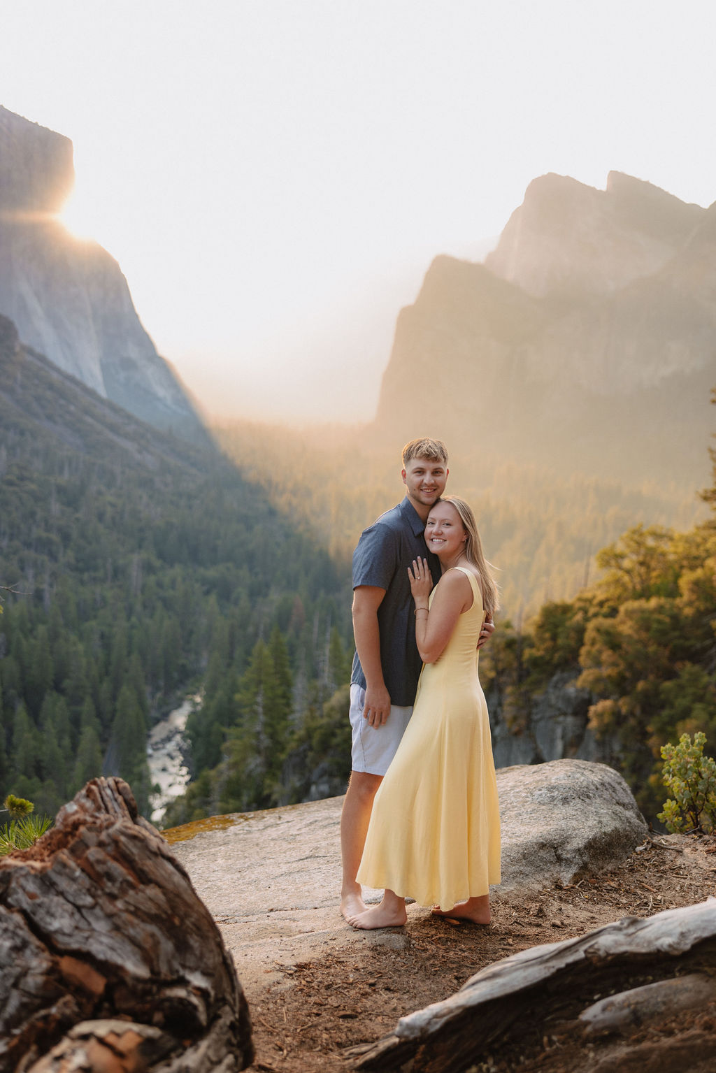 couple takes engagement photos at Tunnel View in Yosemite National Park