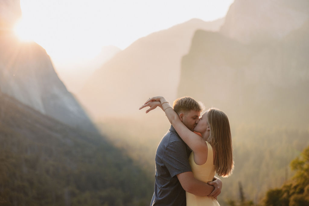 couple takes engagement photos at Tunnel View in Yosemite National Park