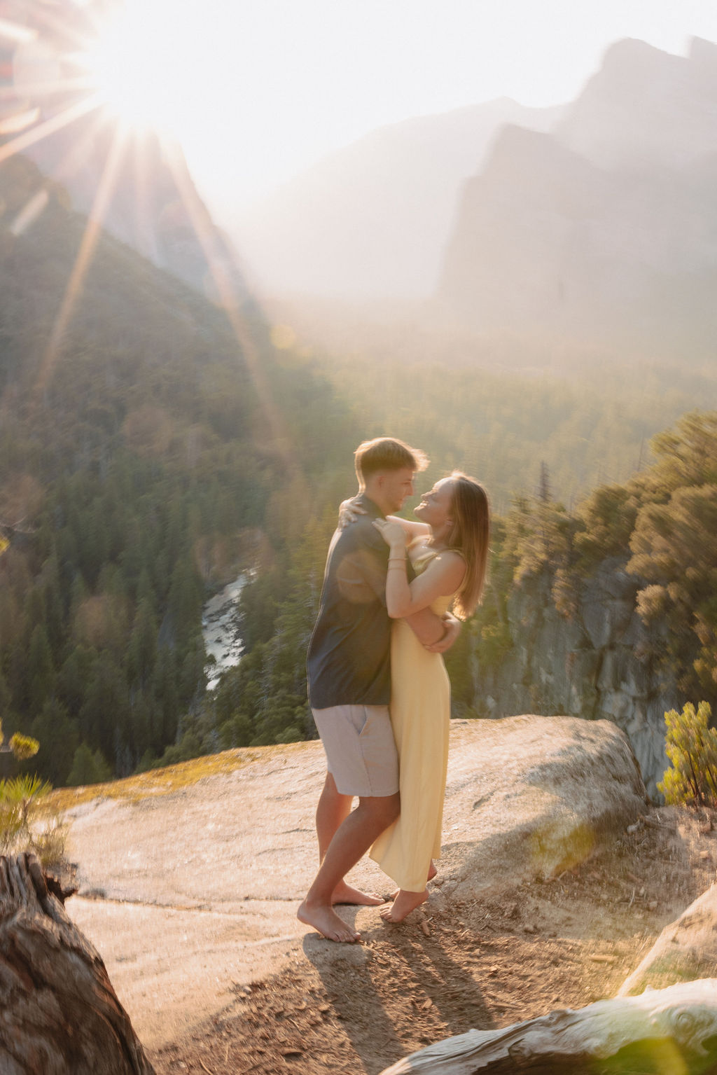 couple takes engagement photos at Tunnel View in Yosemite National Park
