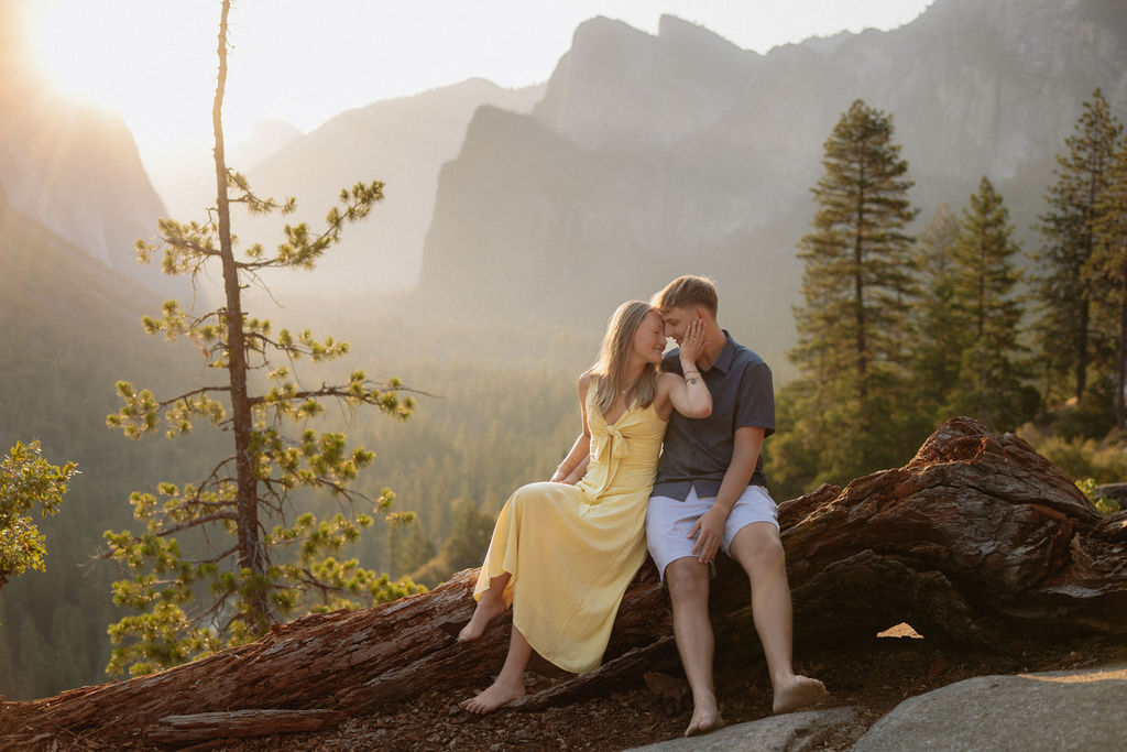 couple takes engagement photos at Tunnel View in Yosemite National Park