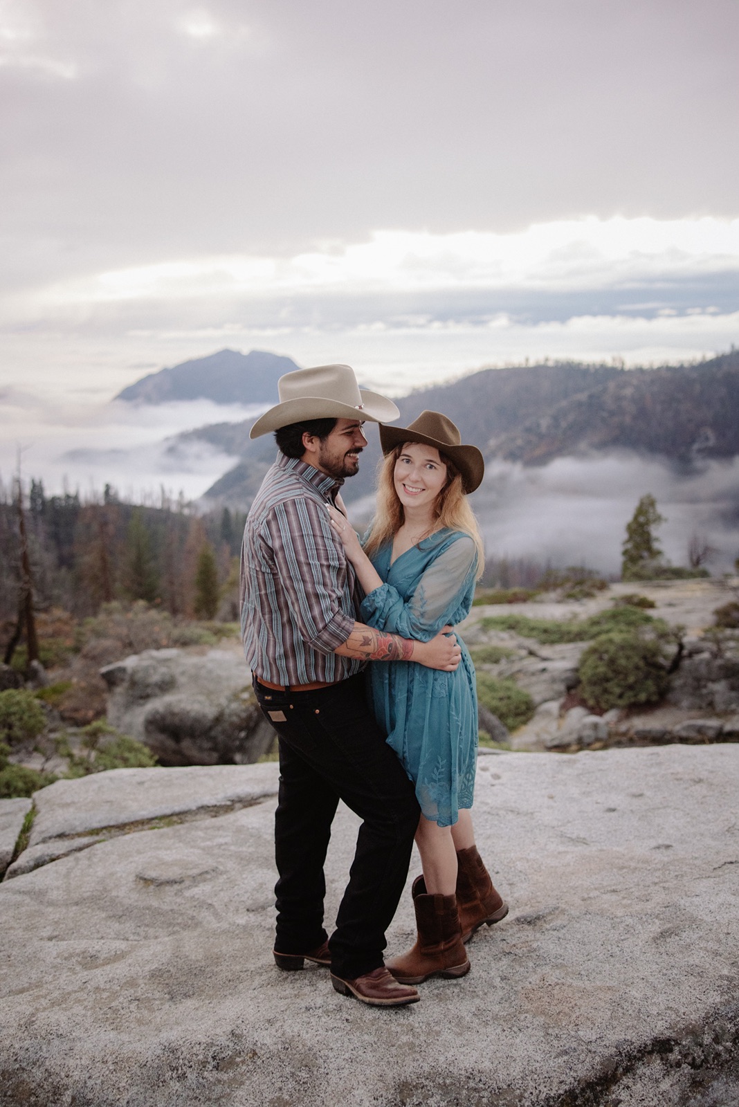 Couple smiles during engagement photos in Sequoia National Park
