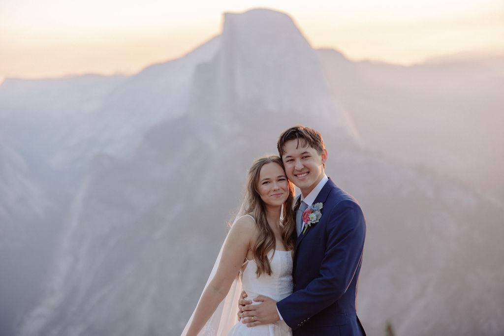 Bride and groom smile at their smokey Yosemite elopement
