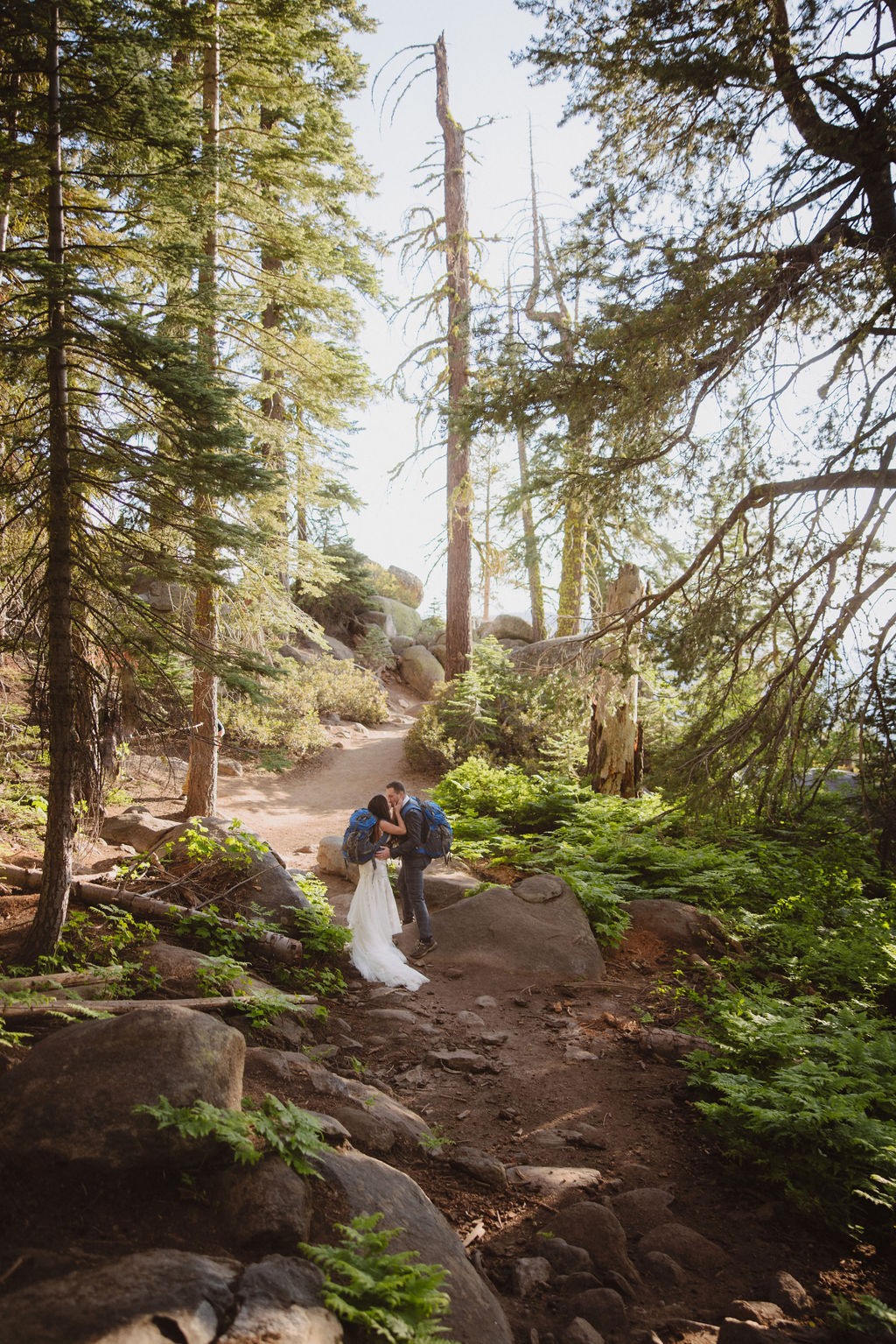 Bride and groom hiking in Yosemite National Park during their elopement