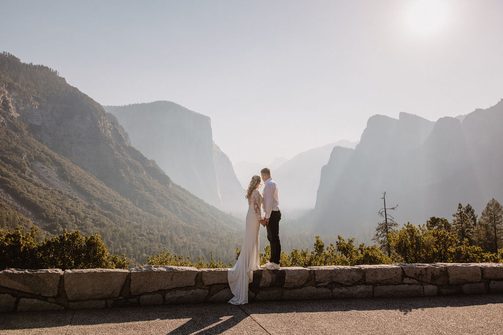 Couple looking out into the mountains at Tunnel View in Yosemite