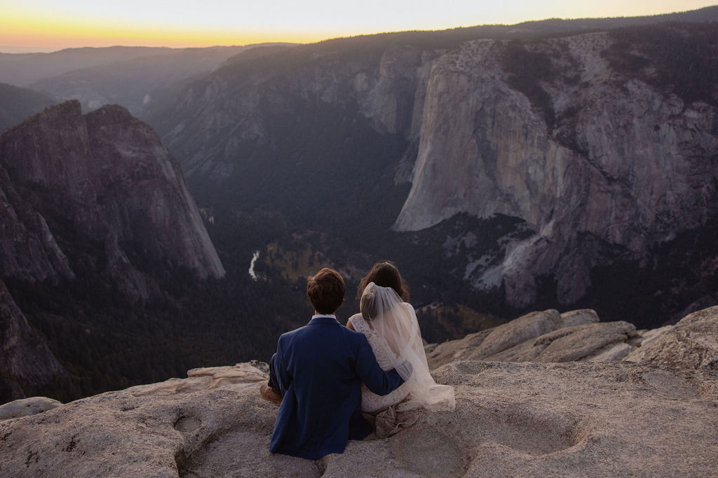 Bride and groom admire sunset at their Yosemite elopement