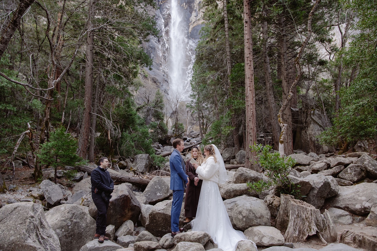 Bride and groom say vows at Bridalveil Fall in Yosemite