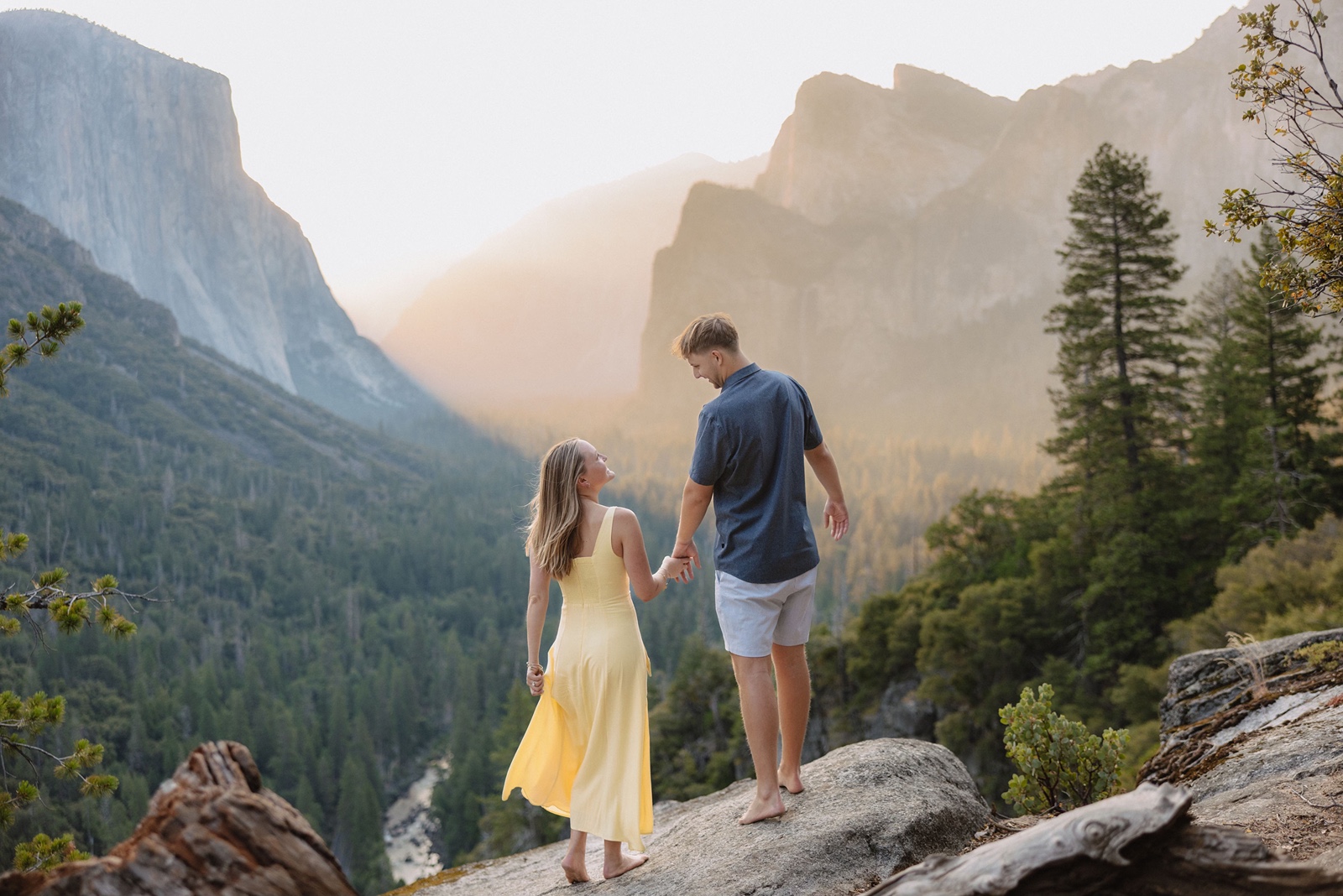 Couple holds hands during their Tunnel View engagement session