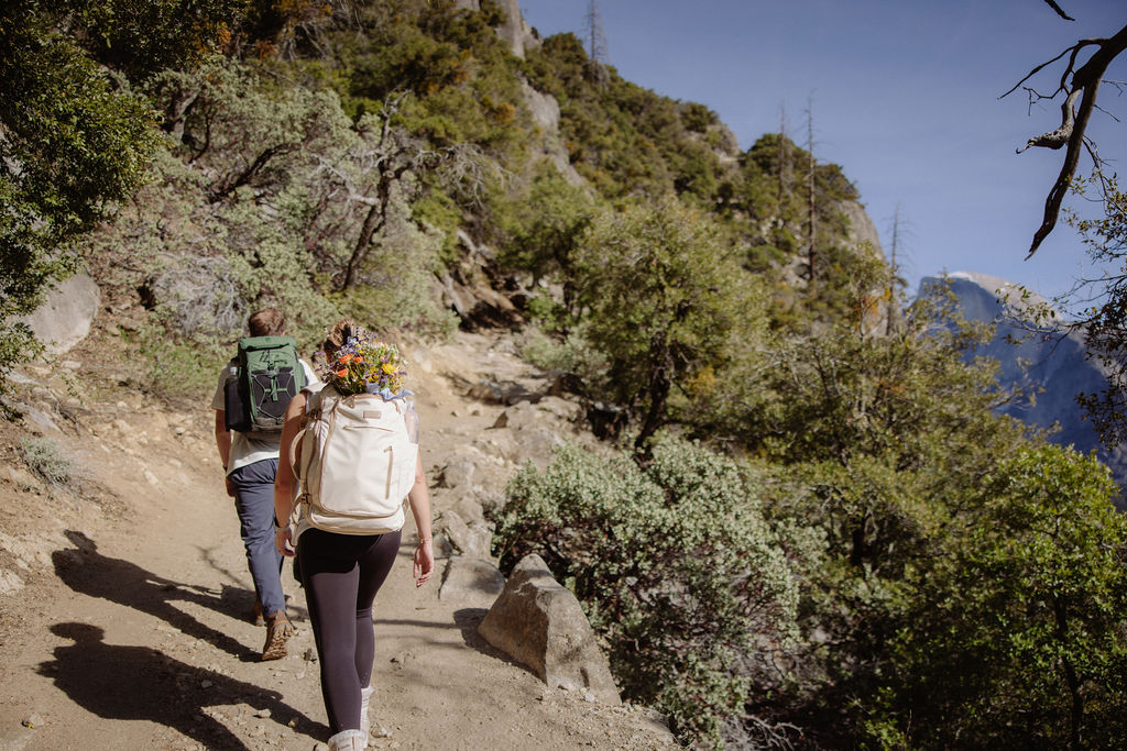 Bride and groom on a hike in Yosemite