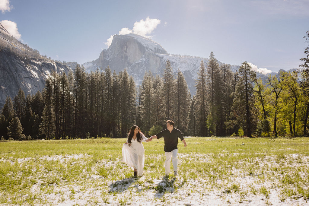 Couple holds hands in Yosemite National Park