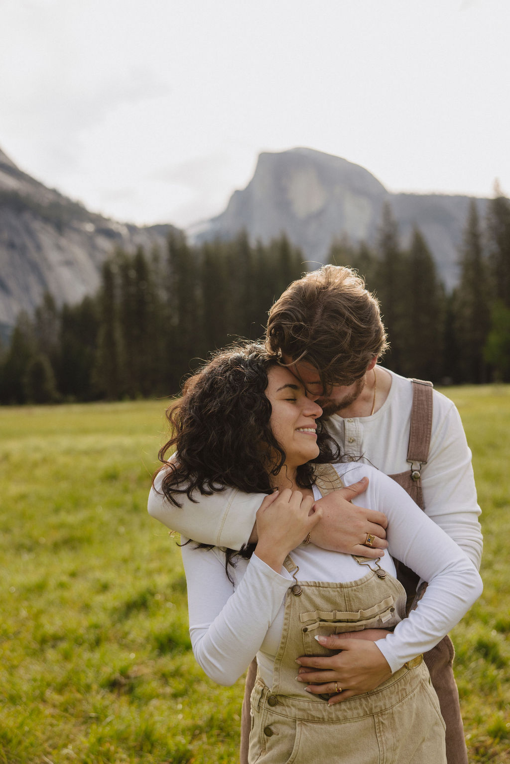 Couple hugs during Yosemite proposal photos
