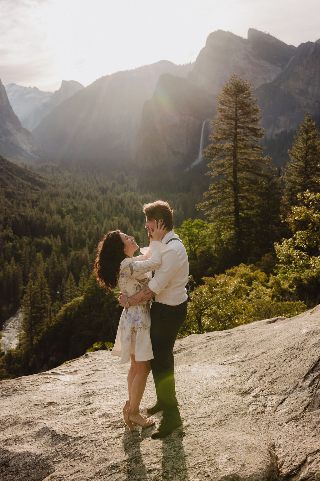 Man and woman smile at each other at Tunnel View