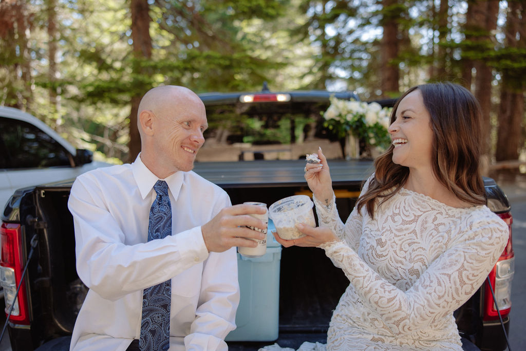 Couple enjoying cake at their Upper Yosemite elopement