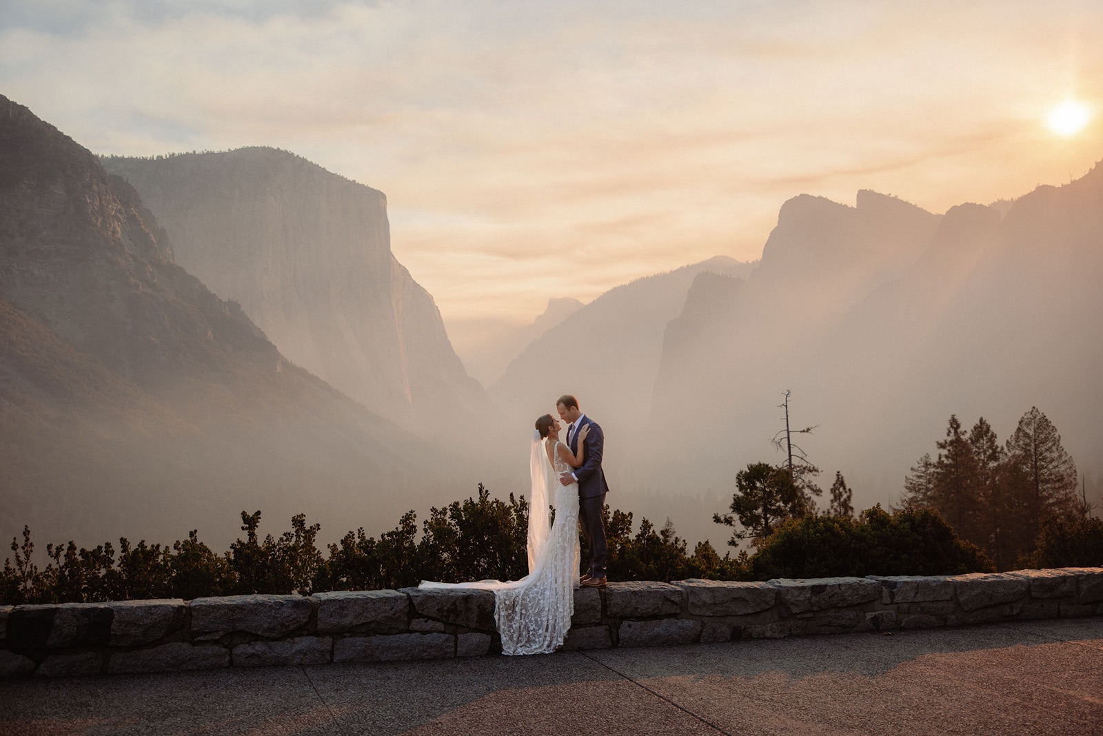 Couple embraces at their smoky Yosemite elopement
